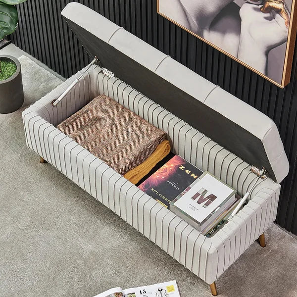 Banc de rangement moderne en velours gris avec pieds dorés