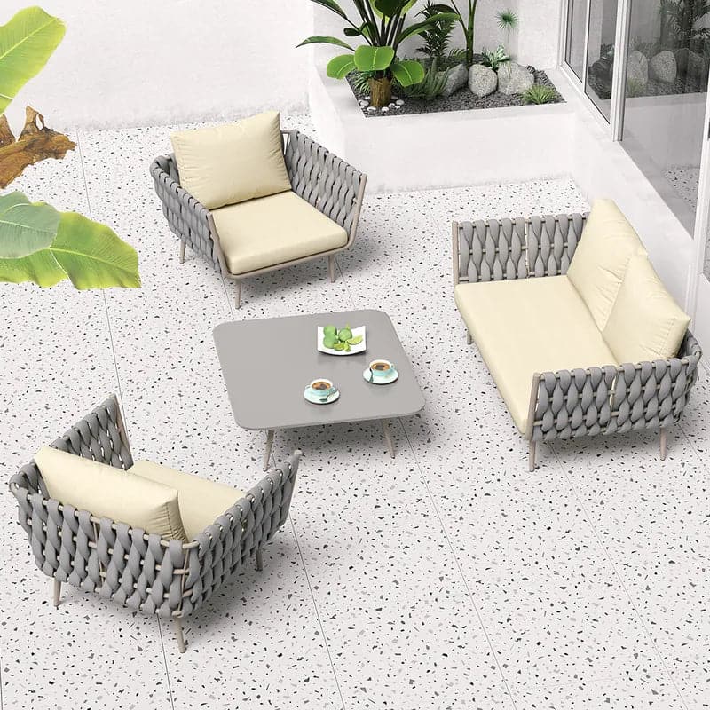 Ensemble de canapés sectionnels d'extérieur 4 pièces avec sièges en sangle et coussins en beige et gris