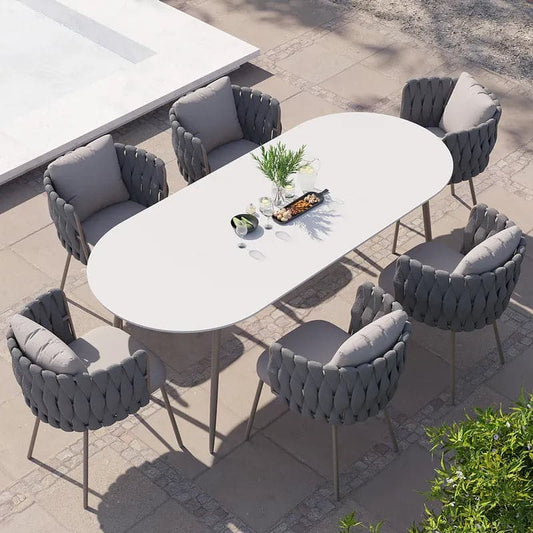 Ensemble de salle à manger d'extérieur 7 pièces avec table ovale en faux marbre et fauteuil en corde tressée